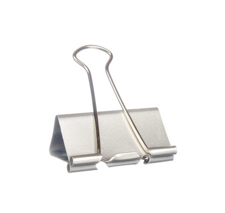 Silver paper clip isolated on white backgroundの写真素材