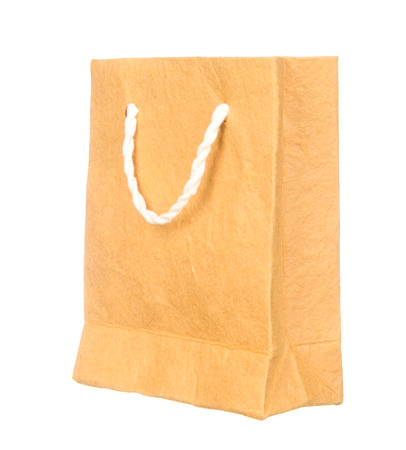 Orange mulberry paper bag isolated on white backgroundの写真素材