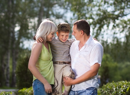 Family having a walk outdoors in summerの写真素材