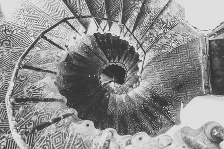 old spiral staircase in houseの写真素材