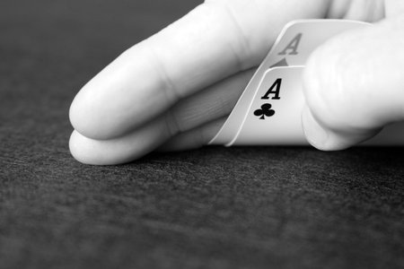 Two aces as part of a poker hand. Time to go all in. Black and white image.