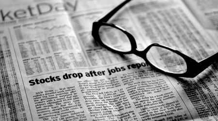 Analysis in a down market - stagflation - Newspaper and glassesの写真素材
