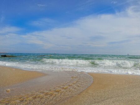 Crystal clear sea waves and blue sky for the perfect summer landscape.の写真素材