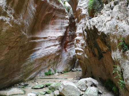A stream of dirty water in Avakas Gorge, Cyprus. During the high season this ravine is a popular touristic place.の写真素材