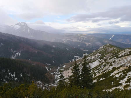 Western Tatra Mountains, Poland. A cold December day and the view to Giewont Peak. The weather is moody and the mist is rising.の写真素材