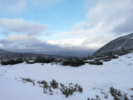 The clouds are starting to disperse over High Tatra Mountains, Poland. A cold and windy December evening in the mountains.の写真素材