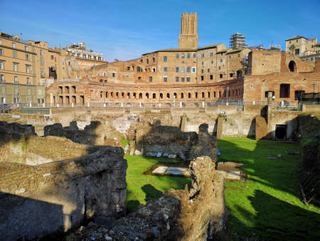 Rome, Italy - December 19th 2018: Tower of Milizie, or Torre delle Milizie on a sunny winter day. It was a medieval shopping center in Rome. In front of it there are the ruins of Trajan's Forum.のeditorial素材