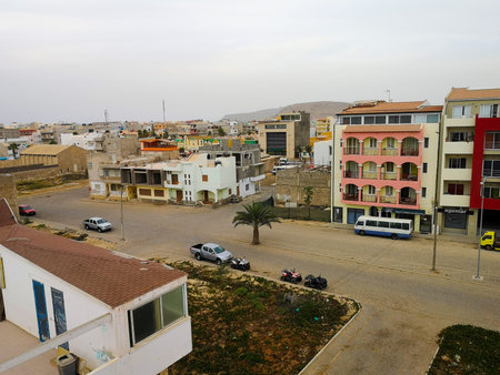 Sal Rei, Cape Verde - February 10th 2019: an empty street of Boa Vista capital city. Some cars...