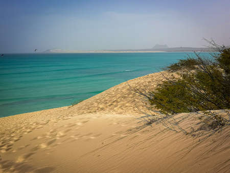 Volcanic hills in the distance, Boa Vista Island, Cape Verde. Atlantic Ocean view from a large sand dune. Selective focus on the horizon, blurred background.の写真素材