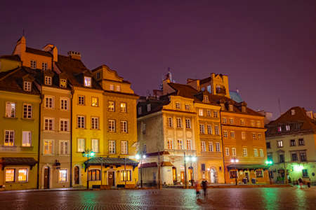 Warsaw, Poland - November 17th 2020: colorful historical buildings in the Old Town. Evening in a Central Market Square, or Rynek Starego Miasta. Medieval architecture rebuilt in 20th century.のeditorial素材