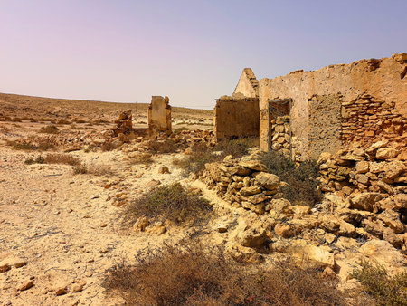Ruins of an old stone building in a desert. Sunny hot afternoon in Africa, remains of village house....