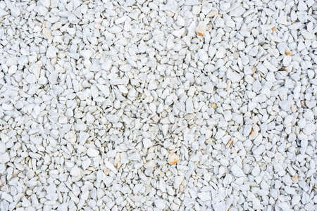 Road gravel, crushed stone. Gravel texture. Crack stones at a construction site. Seamless texture of white stones or gravel textureの写真素材