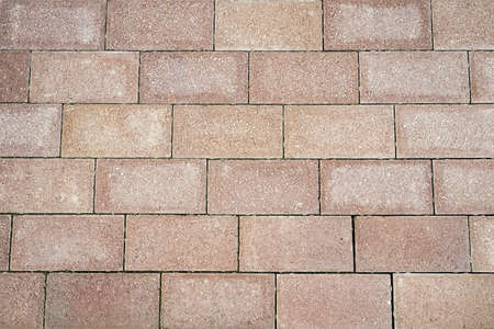 The texture of the paved tile on the bottom of the street. Cement brick squared stone floor background. Concrete paving slabs. Paving slabsの写真素材