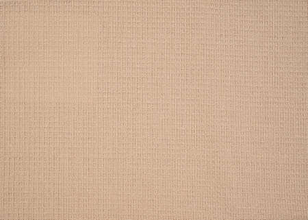 Closeup view of a beige waffle fabric as background, textured waffle towel for background or design in high resolutionの写真素材