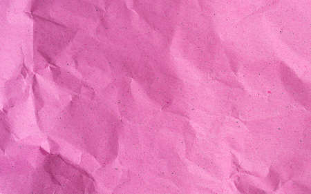 Pink crumpled kraft background paper texture in high resolution, crumpled paper pattern for text, backdrop, wallpaper or designの写真素材