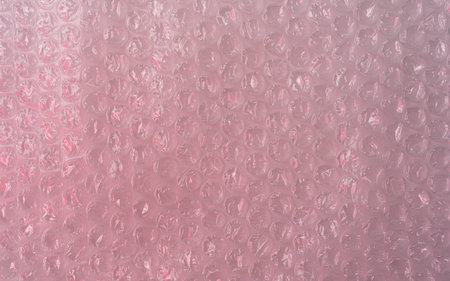 wrap pink colored texture useful as a background or design elements, close up top view with copy...