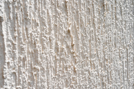 Grungy white concrete wall background with cracked texture in high resolution. Grunge white...