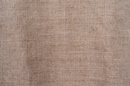 Natural linen background, natural linen sackcloth texture closeup for design Brown light linen texture or background for your designの写真素材