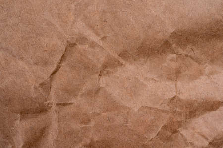 Old vintage crumpled brown paper background texture. Paper texture background, crumpled paper pattern. White creased paper for designの写真素材
