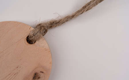 Wooden label tag isolated on white background, Blank brown wooden price tag or label isolated on white background, detail viewの写真素材