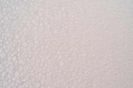 texture background. Plastic foam texture. White board. Polystyrene sheet surface. Abstract circles...