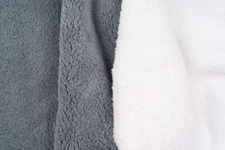 Soft gray and white color cotton flees, elastane and polyester fabric texture background. Warm cozy clothing conceptの写真素材