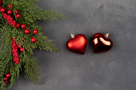 Christmas and New Year decoration with heart shape ornament with Christmas wreath. Christmas background with copy space on a gray concrete table. Valentine conceptの写真素材