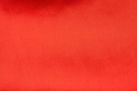 red satin or silk fabric as background, textile material silk. Use for pattern or backgroundの写真素材