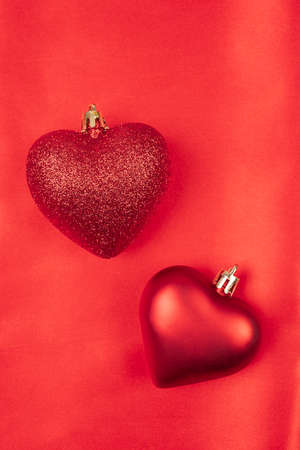 The red Heart shapes on abstract light red background concept for valentines day with sweet and romantic moment, close up top viewの写真素材