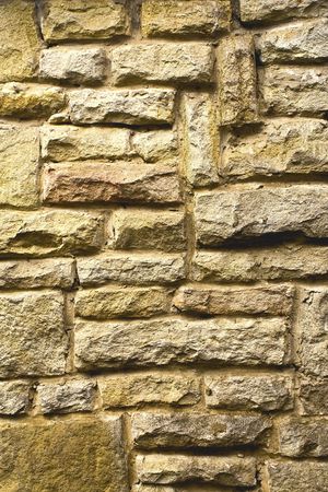 Old stone wall, built out of rubble.の写真素材