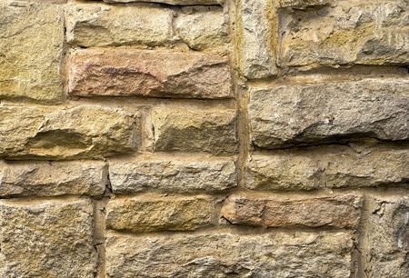 Old stone wall, built out of rubble.の写真素材