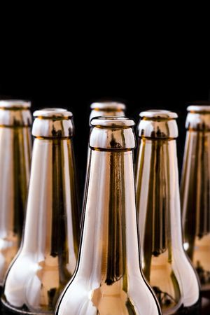 An open beer bottle, black background isolated.の写真素材