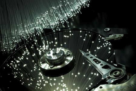 Computer hard disc, illuminated optical fiber. の写真素材