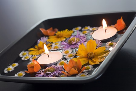 Petals decorated with air freshener and candles.の写真素材