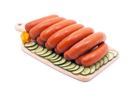 Delicious sausages, vegetables, decorated with a white background isolated.の写真素材