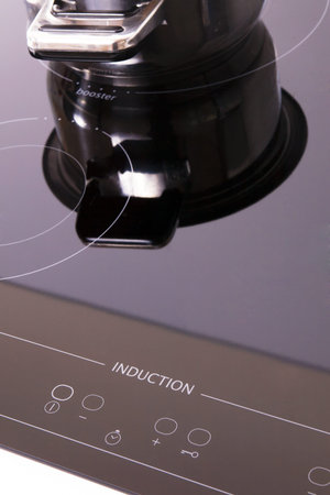 Induction stove, pot metal on it.の写真素材