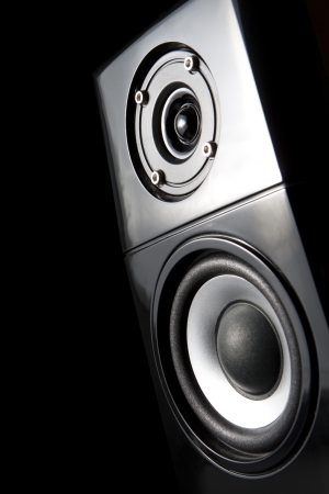 Speaker decoratively illuminated on a dark background の写真素材