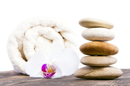 Stones towel and orchid beside him の写真素材