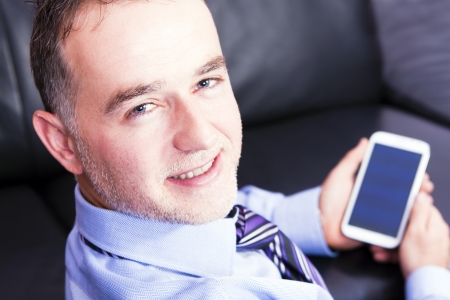 Successful businessman using a smart phoneの写真素材