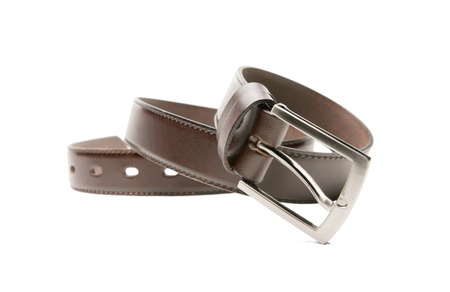 Brown leather belt with a white background の写真素材