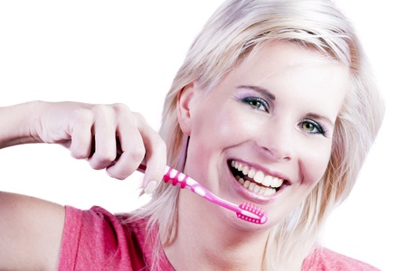 Beautiful girl with brushes his teeth.の写真素材