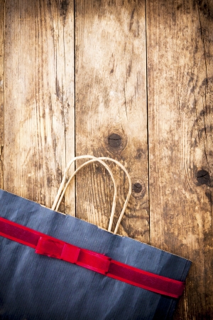 Rustic wooden background paper bag の写真素材