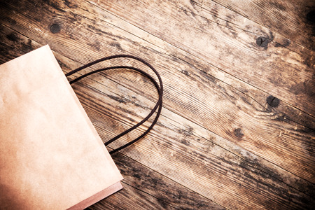 Paper bag rustic wooden background.の写真素材