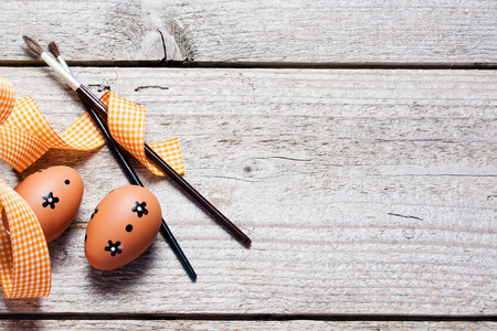 The wooden background decorated Easter eggs の写真素材