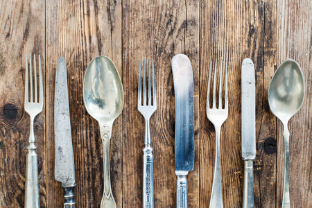 Wood background old cutlery together.の写真素材