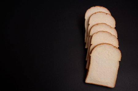 Soft bread on a black background.