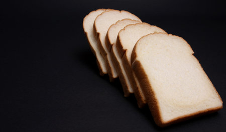 Soft bread on a black background.