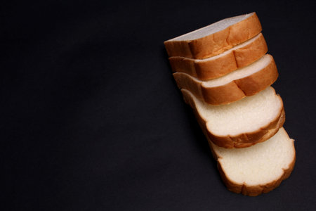Soft bread on a black background.の写真素材