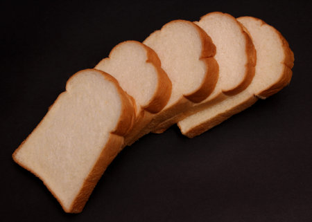 Soft bread on a black background.