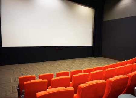 cinema screen with open orange seats